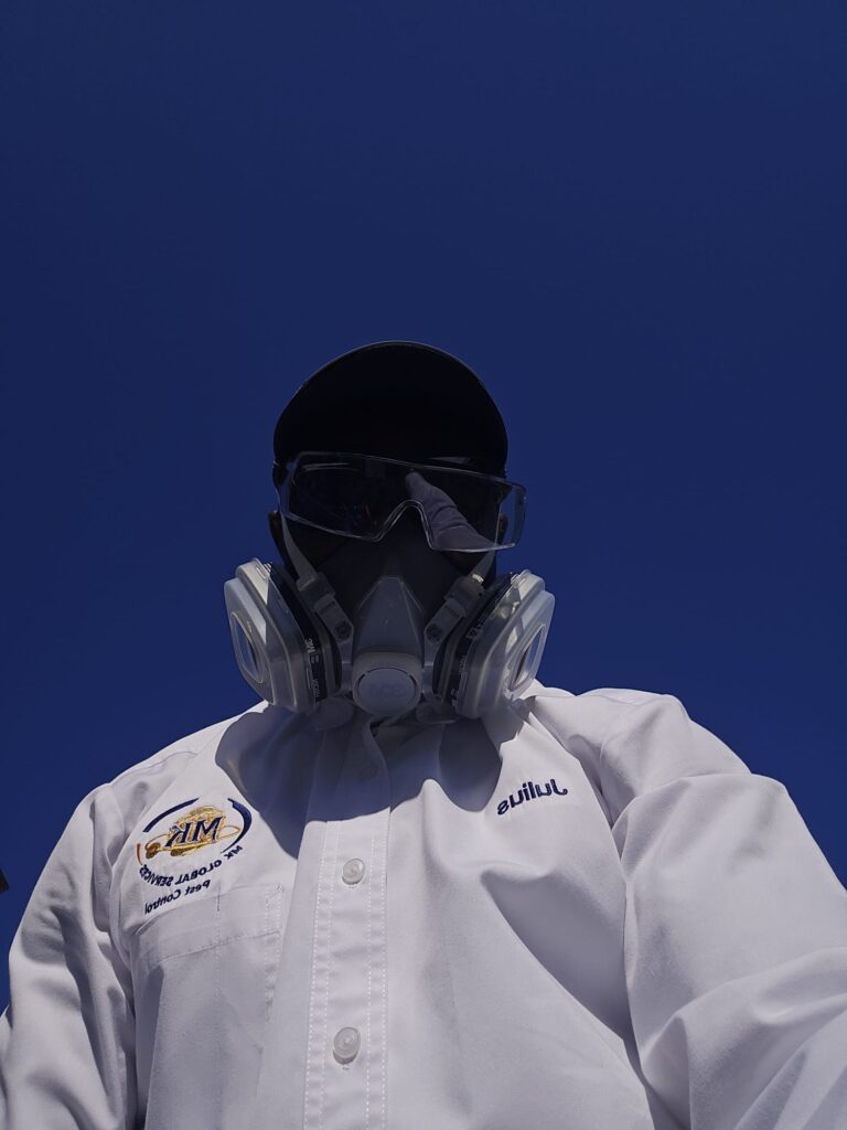 MK Global Pest Control technician after job completion.